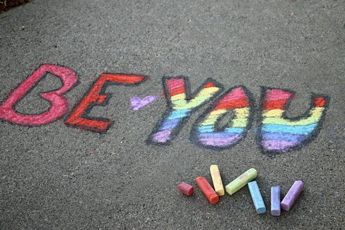 conceptual-message-written-on-a-sidewalk-with-colorful-chalk_t20_noKJ9K-696x464
