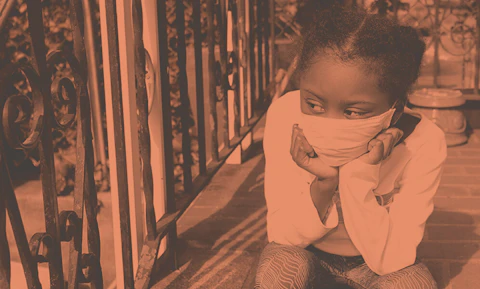 young girl wearing face mask looking sad on stoop