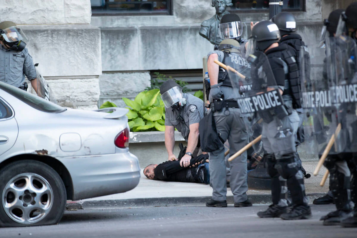 Kentucky State Police detain a man on West Liberty Street on Sunday, May 31, 2020, in downtown Louisville, Kentucky. (Max Gersh/The Courier Journal)
