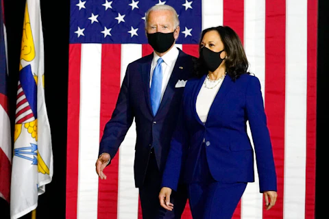 Semocratic presidential candidate former Vice President Joe Biden and his running mate Sen. Kamala Harris, D-Calif., arrive to speak at a news conference at Alexis Dupont High School in Wilmington, Del. (AP Photo/Carolyn Kaster)