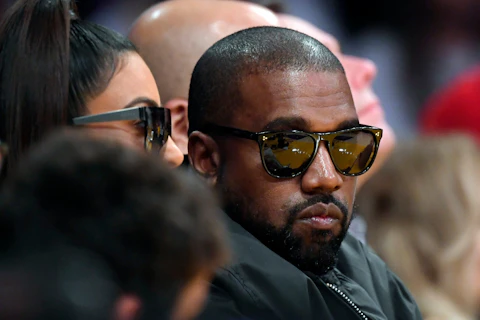 Kim Kardashian, left, and rapper Kanye West watch during the second half of an NBA basketball game between the Los Angeles Lakers and the Cleveland Cavaliers, Monday, Jan. 13, 2020, in Los Angeles. The Lakers won 128-99. (AP Photo/Mark J. Terrill)