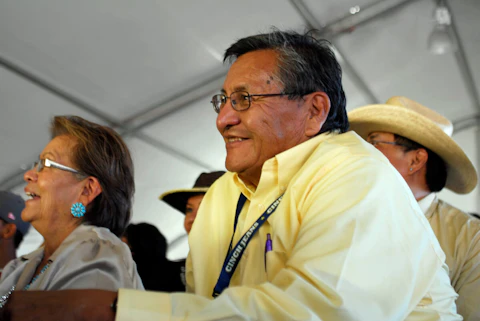 Ben Shelly sits among a crowd awaiting results of the Miss Navajo Nation pageant in Window Rock, Ariz., on Sept. 11, 2010. Shelly, the former Navajo Nation President, died Wednesday, March 22, 2023, in New Mexico after a long illness, family spokesman Deswood Tome said.(AP Photo/Felicia Fonseca)