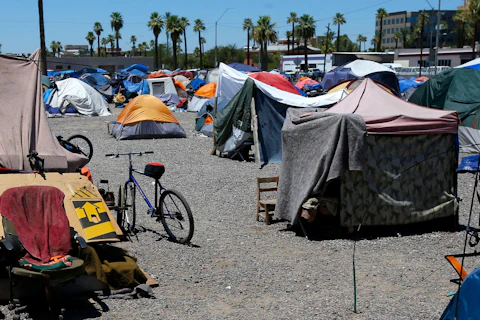 FILE - A large homeless encampment is shown in Phoenix, on Aug. 5, 2020. Five major U.S. cities, including Phoenix, and the state of California will receive federal help to get unsheltered residents into permanent housing under a new plan announced Thursday, May 18, 2023, as part of the Biden administration's larger goal to reduce homelessness 25% by 2025. (AP Photo/Ross D. Franklin, File)