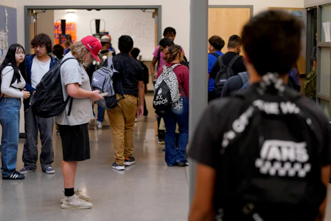 Westwood High School students make their way to classes, Tuesday, Oct. 18, 2022 in Mesa, Ariz. (AP Photo/Matt York)
