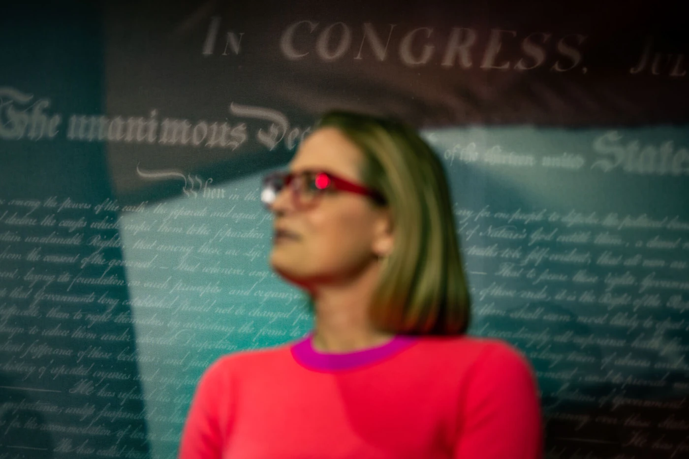 WASHINGTON, DC - NOVEMBER 29: Sen. Kyrsten Sinema (D-AZ) listens during a news conference in the U.S. Capitol Building following a vote to pass the Respect For Marriage Act on Capitol Hill on Tuesday, Nov. 29, 2022 in Washington, DC. (Kent Nishimura / Los Angeles Times via Getty Images)