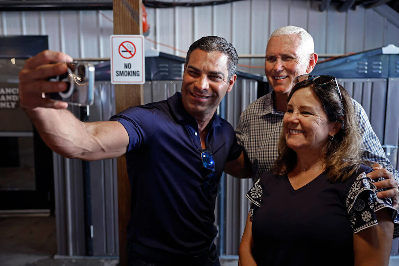 DES MOINES, IOWA - AUGUST 11: Miami Mayor Francis Suarez (L) poses for a selfie with former U.S. Vice President Mike Pence and his wife Karen Pence in between interviews with Iowa Governor Kim Reynolds during the Iowa State Fair on August 11, 2023 in Des Moines, Iowa. Both men are running for the Republican presidential nomination and are spending time at the fair, a political tradition in one of the first states to hold caucuses in 2024. (Photo by Chip Somodevilla/Getty Images)