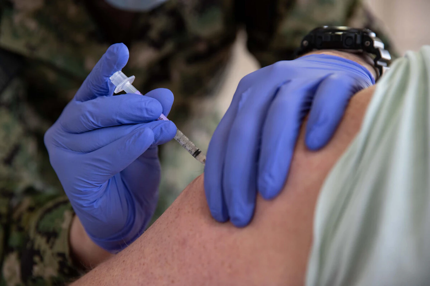 A corpsman with the USS Gerald R. Ford gives a COVID-19 vaccination at Naval Station Norfolk on April 8, 2021. (Photo by Seaman Jackson Adkins/U.S. Navy)