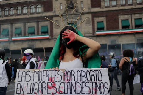 A woman dressed as the Virgin of Guadalupe demonstrates in front of the National Palace in the Zocalo in Mexico City on the occasion of the International Day of Global Action in favour of legal, free and safe abortion in Mexico and Latin America. (Photo by Gerardo Vieyra/NurPhoto via Getty Images)