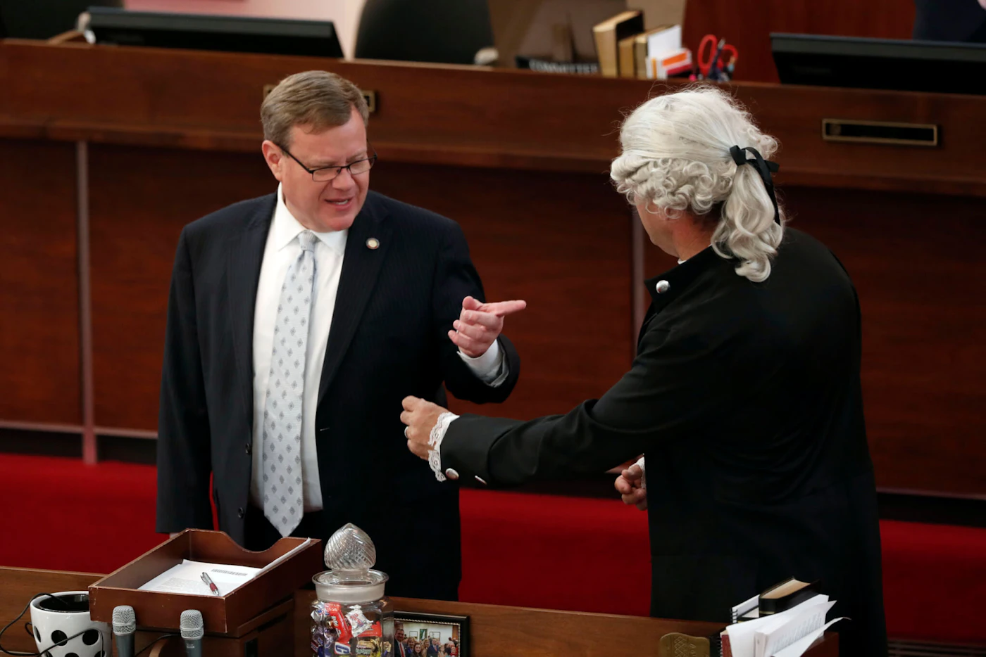House Speaker Tim Moore, R-Cleveland, left, speaks with Rep. Michael Speciale, R-Craven, wearing colonial attire, in this April file photo. Lawmakers like Speciale have framed coronavirus as a debate over constitutional liberties. (AP Photo/Gerry Broome)