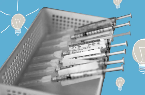 Syringes containing the Pfizer-BioNTech COVID-19 vaccine sit in a tray in a vaccination room at St. Joseph Hospital in Orange, Calif. (AP Photo/Jae C. Hong, File/Treatment by Rebecca Russ)