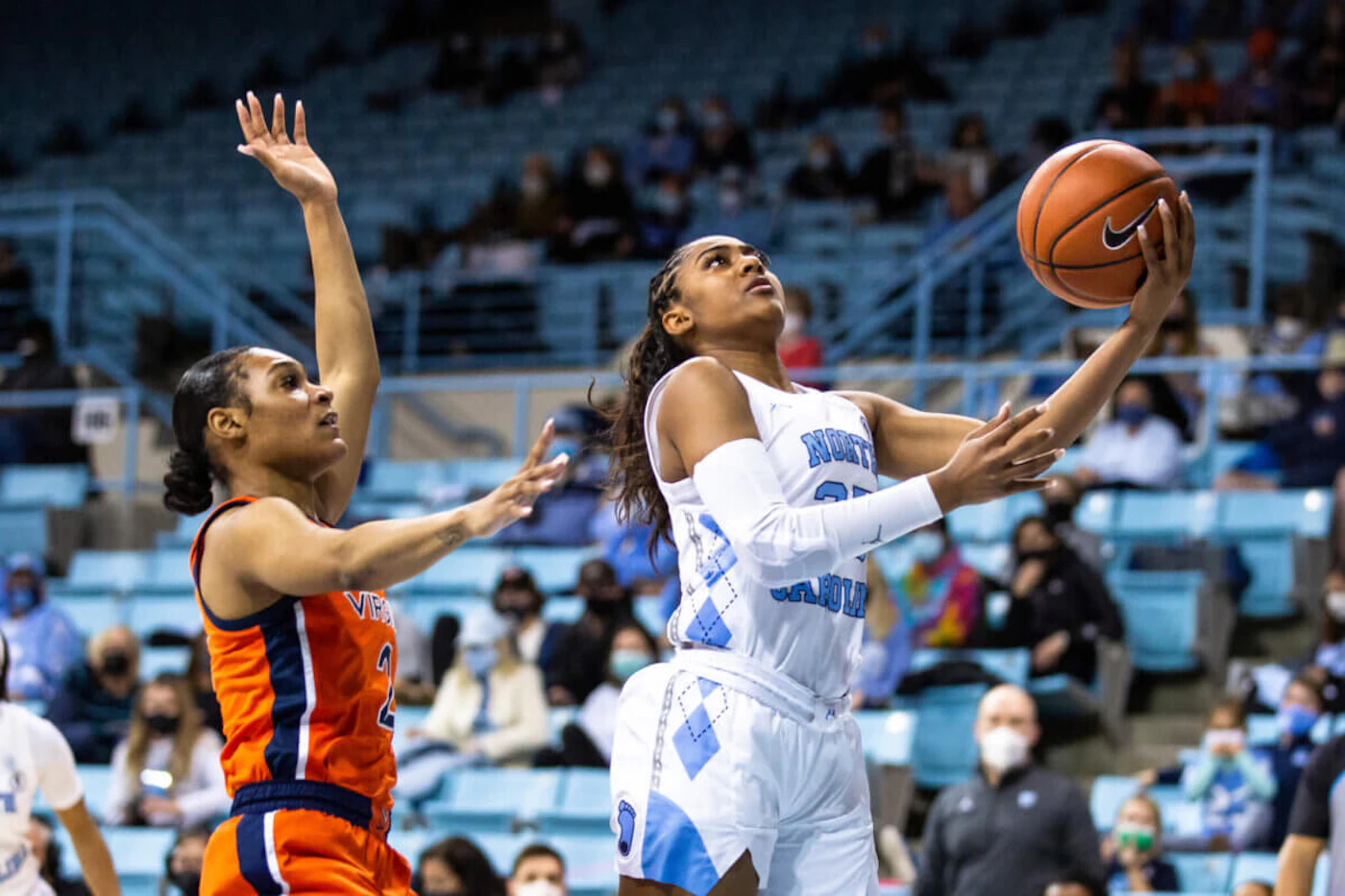 North Carolina's Deja Kelly attempts a layup during a Jan. 21 game with Virginia. Women's college teams like UNC, NC State, and UNC Charlotte have made it a golden time to be a fan in North Carolina. (AP Photo/Ben McKeown)