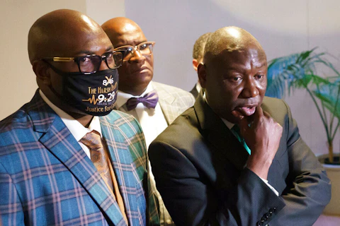 Philonise Floyd, brother of George Floyd, left, and Benjamin Crump, civil rights attorney who represented the family of George Floyd, right, pause for reporters at the Capitol in Washington, on May 25, 2021. (Image via AP Photo/J. Scott Applewhite, File)