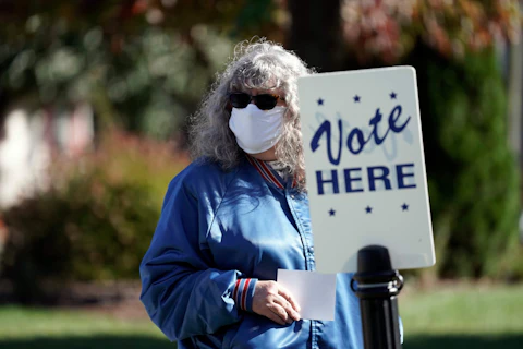 A voter waits to cast a ballot at the Graham Civic Center polling location in Graham, N.C., Tuesday, Nov. 3, 2020. (AP Photo/Gerry Broome)