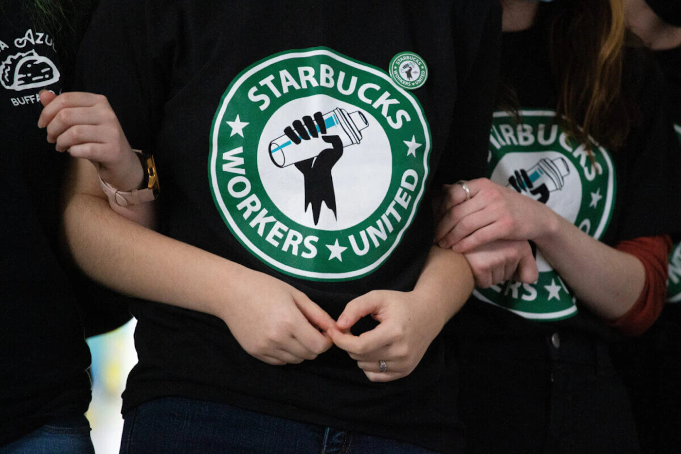 Starbucks employees and supporters react as votes are read during a union-election watch party in New York in 2021. The labor movement at the coffee giant is gaining steam in the U.S. Workers at a Boone location became the first Starbucks location to unionize in NC in May. (AP Photo/Joshua Bessex, File)