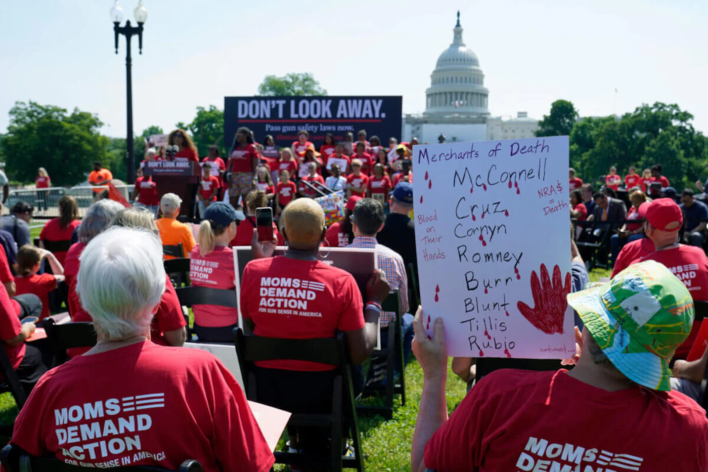 People attend a protest near Capitol Hill in Washington, Wednesday, June 8, 2022, sponsored by Everytown for Gun Safety and its grassroots networks, Moms Demand Action and Students Demand Action, as gun violence survivors and hundreds of gun safety supporters demand that Congress act on gun safety issues. (AP Photo/Susan Walsh)