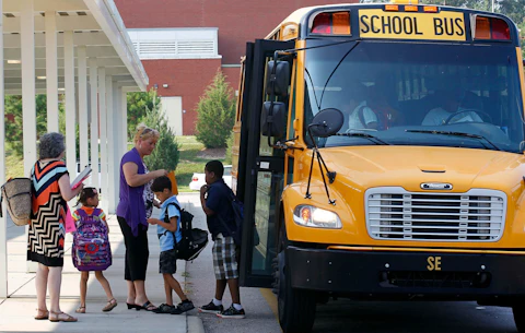 Students return for their first day of classes at Barwell Road Elementary School in Raleigh, N.C., Monday, July 9, 2012. (AP Photo/Gerry Broome)