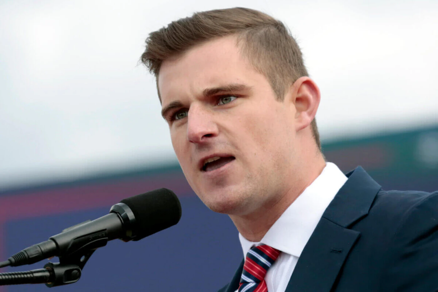 Republican candidate for U.S. House of Representatives Bo Hines, of North Carolina, speaks to the crowd before former President Donald Trump takes the stage at a rally Saturday, April 9, 2022, in Selma, N.C. (AP Photo/Chris Seward)