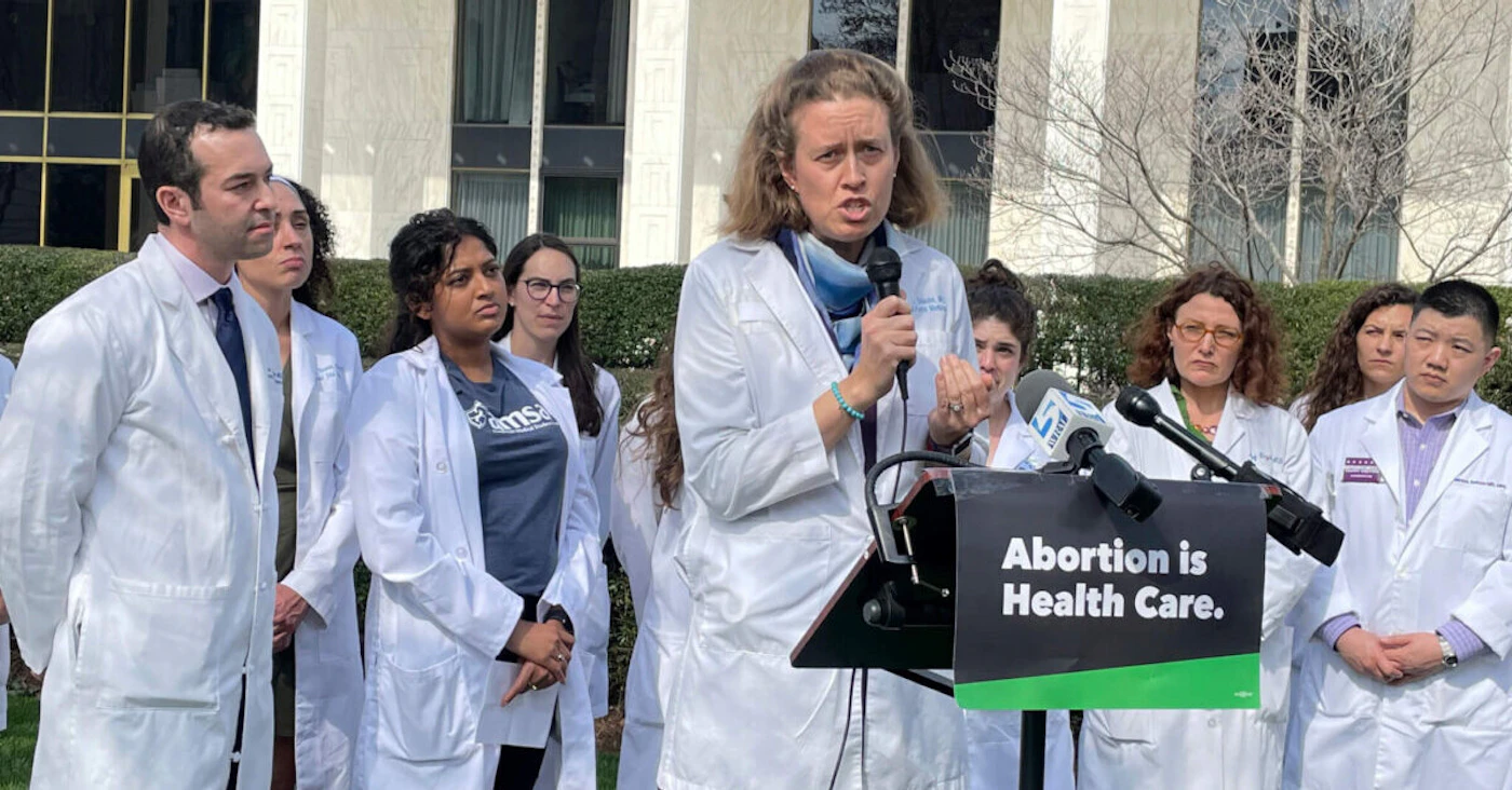 Dr. Alison Stuebe, a North Carolina maternal-fetal medicine doctor, urges state lawmakers to oppose any new abortion restrictions at a news conference outside the Legislative Building in Raleigh, N.C., on Wednesday, Feb. 22, 2023. (AP Photo/Hannah Schoenbaum)