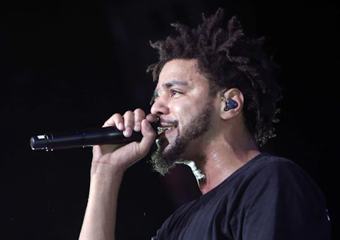 North Carolina native J. Cole in concern in 2015. Cole's Dreamville Festival is one of our favorite ways to see live music again. (Photo by Robb D. Cohen/Invision/AP)