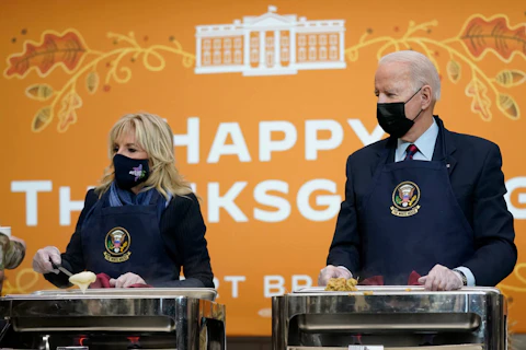 President Joe Biden and first lady Jill Biden serve dinner during a visit to Fort Bragg (Now called Fort Liberty) for Thanksgiving in 2021.  (AP Photo/Evan Vucci)