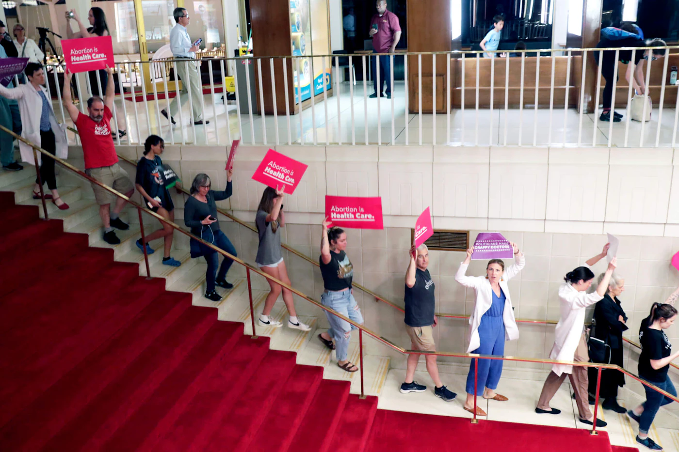 Abortion rights protesters are removed from the General Assembly on May 16, 2023 after shouting "shame, shame," when legislators overrode Gov. Roy Cooper's veto of the 12-week abortion ban. (AP Photo/Chris Seward)