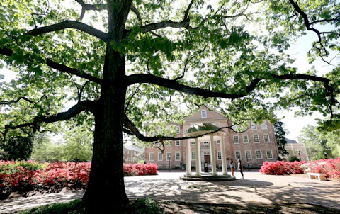 In this photo taken Monday, April 20, 2015 the Old Well is seen in front of the South Building on campus at The University of North Carolina in Chapel Hill, N.C. (AP Photo/Gerry Broome)