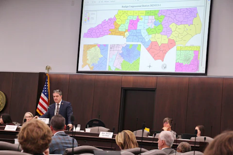 The North Carolina state Senate last month reviews copies of a map proposal for the state's congressional districts starting in 2024. (AP Photo/Hannah Schoenbaum)