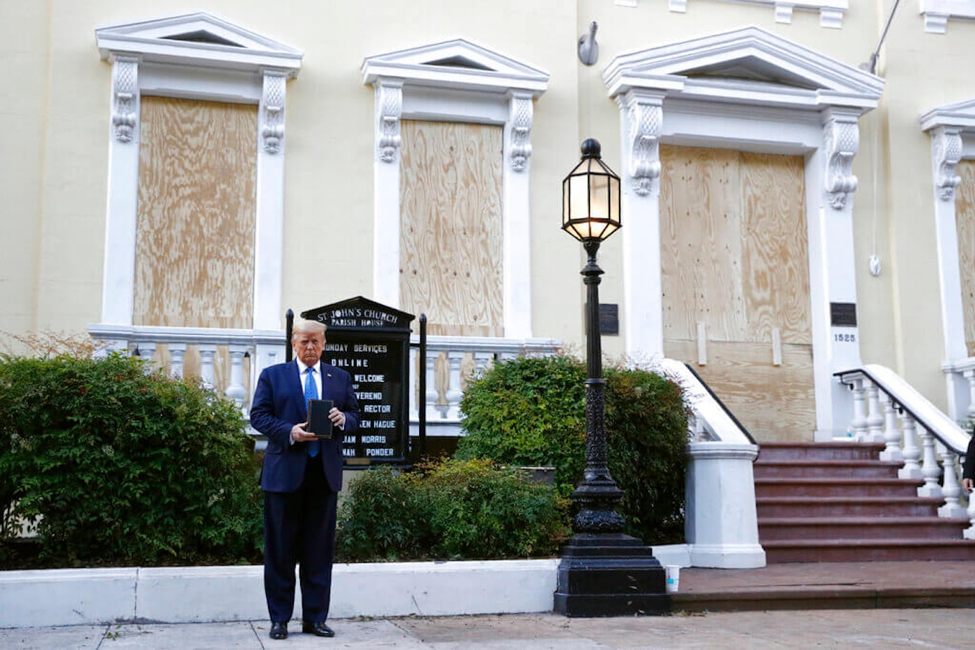 President Donald Trump holds a Bible after using tear gas to clear peaceful protestors from St. John's Church across from the White House on Monday, June 1, 2020, in Washington. (AP Photo/Patrick Semansky)