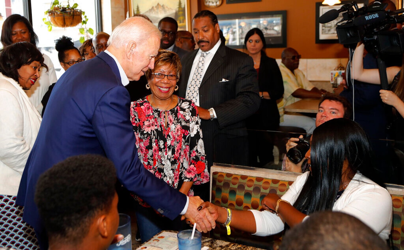 His plan proposes to rectify entrenched racial inequalities among Blacks and other ethnic minorities. Joe Biden with supporters