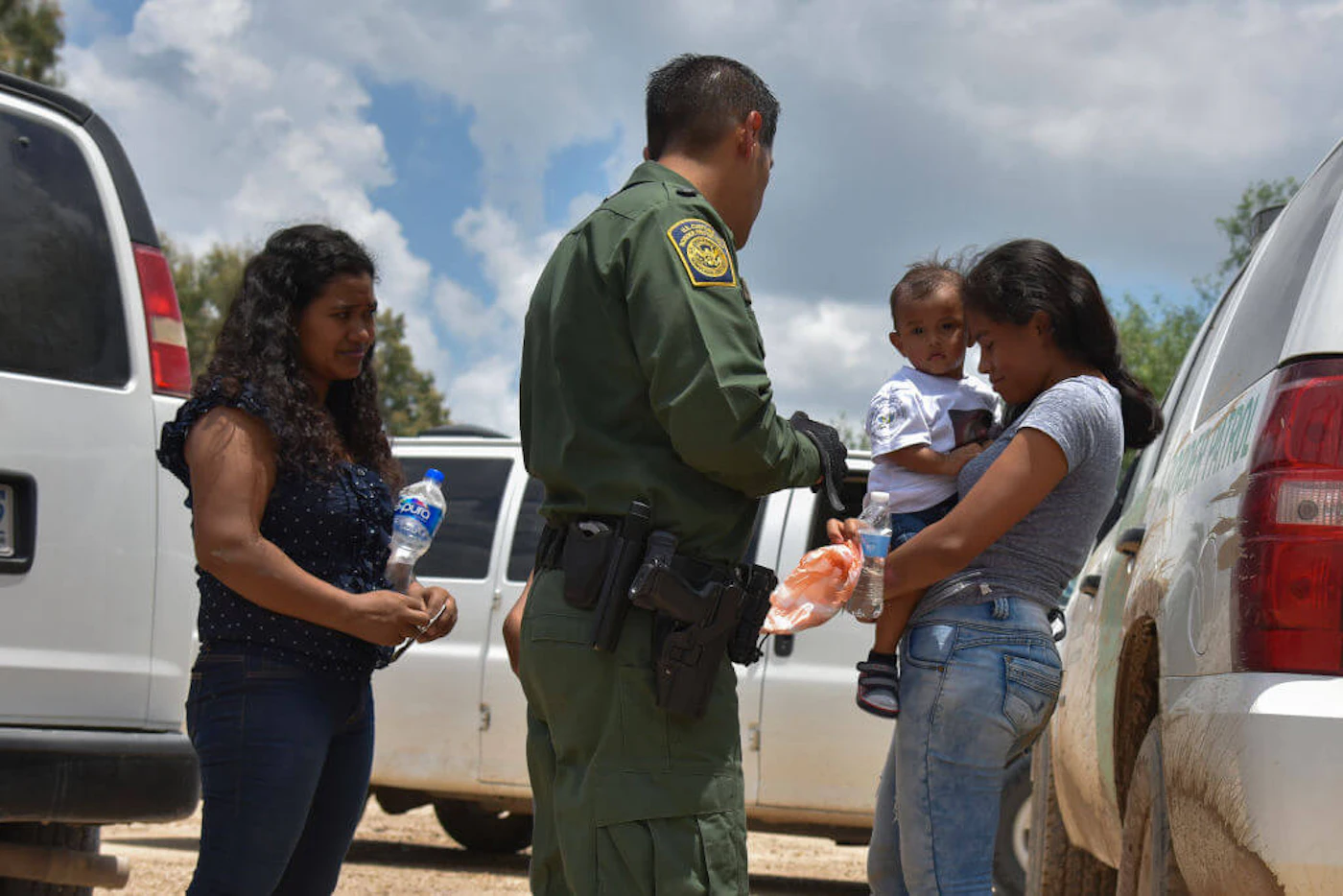 Two young mothers from Honduras, L and R, and their respective children, a 12-year-old, blocked, and 1-year-old, are detained by United States Border Patrol after rafting across the Río Grande on the US-Mexico border on Monday, June 25, 2018, in Granjeno, Texas. biden-545-children