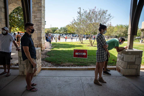 Voters wait in line at a polling location in Austin, Texas. Photo by Sergio Flores/Getty Images.