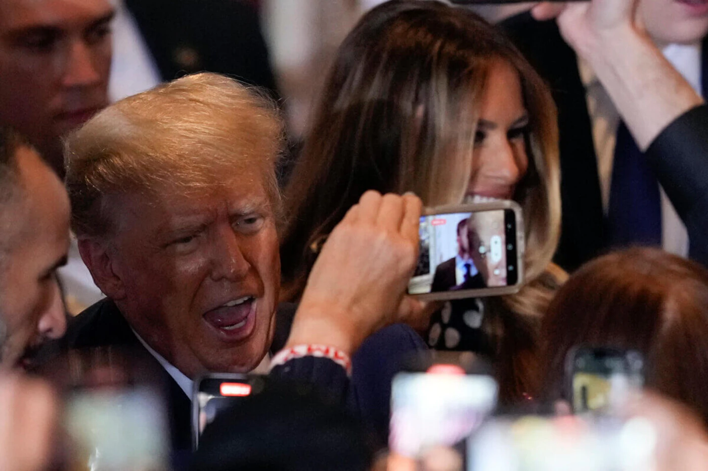 Former President Donald Trump greets supporters after announcing a third run for president at Mar-a-Lago in Palm Beach, Fla., Tuesday, Nov. 15, 2022. Former first lady Melania Trump is at right. (AP Photo/Rebecca Blackwell)