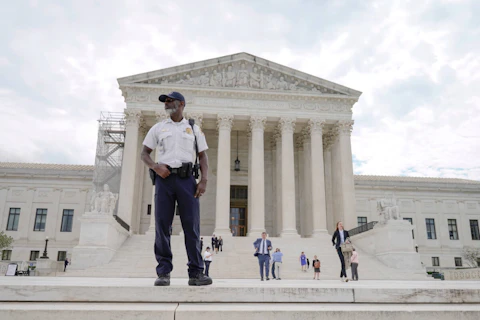 A police officer stands outside of the U.S Supreme Court, Tuesday, June 27, 2023, in Washington. (AP Photo/Mariam Zuhaib)