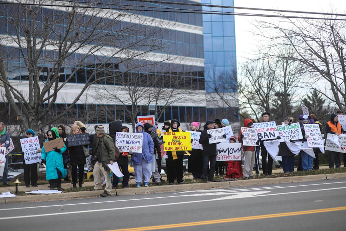 Fairfax, VA - December 14, 2017: Protesters gather outside the National Rifle Association for a vigil on the fifth anniversary of the Sandy Hook Elementary School shooting in Newtown, Connecticut. (Shutterstock)