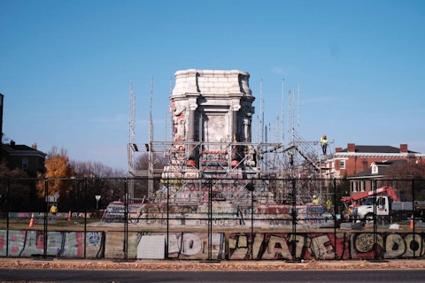 Construction workers erect scaffolding around a pedestal as they prepare to dismantle it on December 6, 2021 in Richmond, Virginia.  (Photo by Eze Amos/Getty Images)