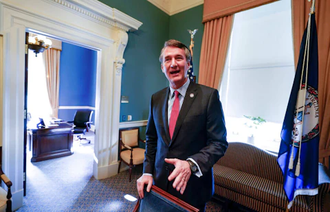 Virginia Gov. Glenn Youngkin gestures after signing a House bill in the conference room at the Capitol Wednesday March 2, 2022, in Richmond, Va. (AP Photo/Steve Helber)