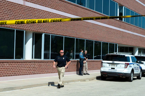 Law enforcement investigate after an attack at the office of Rep. Gerry Connelly, D-Va., in Fairfax, Va., Monday, May 15, 2023. A man with a baseball bat walked into Connolly's Fairfax office, asked for him, and then struck two members of his staff with the bat, police said. Fairfax City Police in northern Virginia said in a tweet that a suspect is in custody and the victims are being treated for injuries that are not life-threatening. (AP Photo/Cliff Owen)
