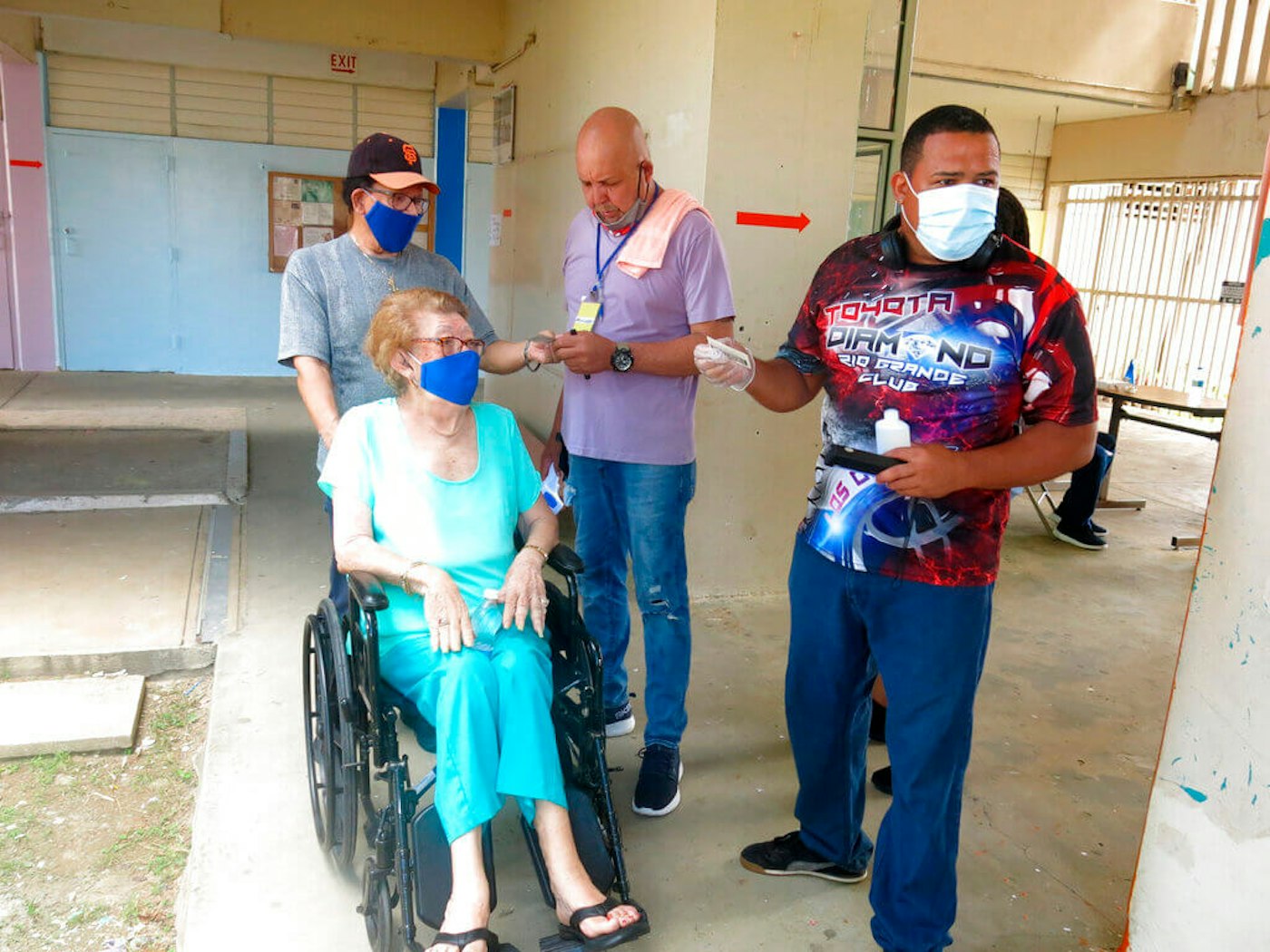 A volunteer assists voters in Loíza, Puerto Rico. Thousands of Puerto Ricans on Sunday got a second chance to vote for the first time, a week after delayed and missing ballots marred the original primaries in a blow to the U.S. territory’s democracy. Puerto - Rico - Botched - Primaries