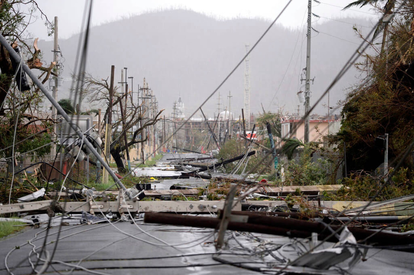 This file photo shows smashed poles and snarled power lines brought down by Hurricane María, in Humacao, Puerto Rico on Sept. 20, 2017. Puerto-Rico-Hurricane-Maria-One-Month-Later