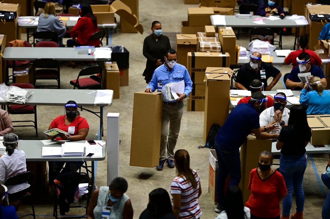 JAVAA officials count early votes at the Roberto Clemente Coliseum where social distancing is possible amid the COVID-19 pandemic. Election-Results-Puerto-Rico