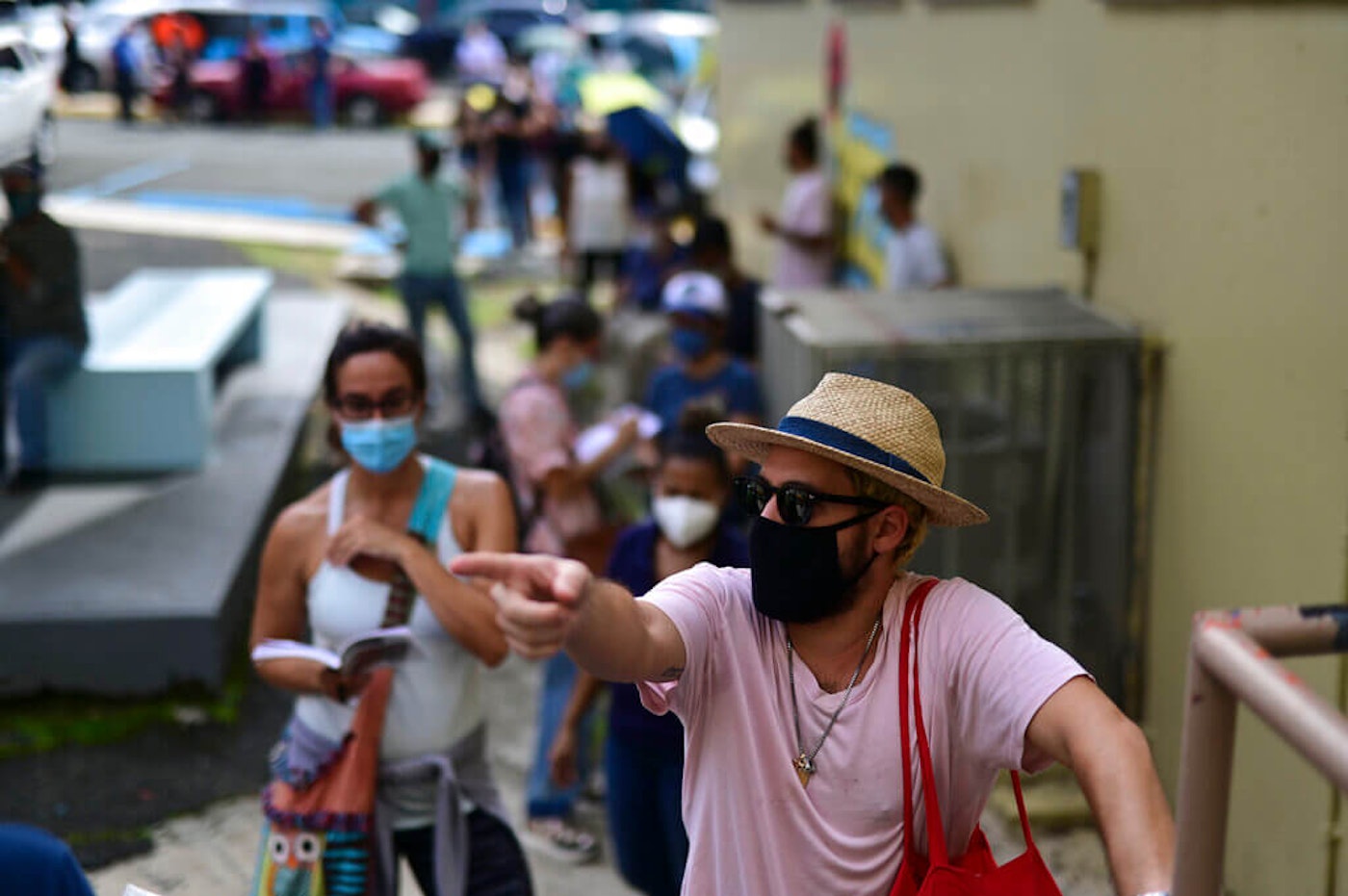 Experts have warned that the situation can worsen this week and next, when infections resulting from the thousands of people exposed on Election Day start showing in reports. In the picture, people wearing masks waited in line to vote at the Rafael Labra School in San Juan. Puerto-Rico-COVID