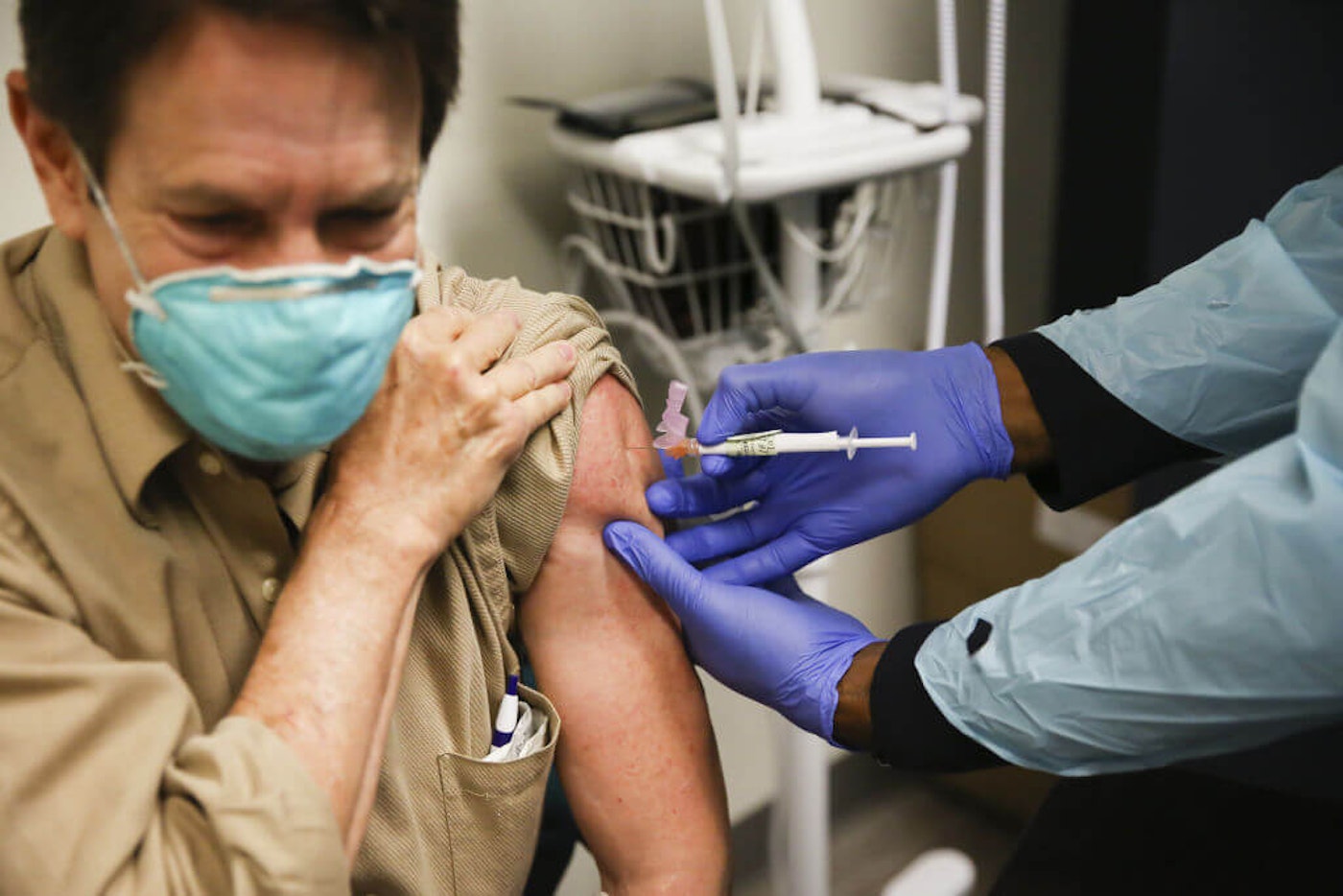 Steve Brandwene, a healthcare worker, 64 years old, receives a Pfizer-BioNtech COVID-19 vaccine at Research Centers of America in Hollywood, Florida, on Dec. 18, 2020. florida-vaccinate-65-and-older