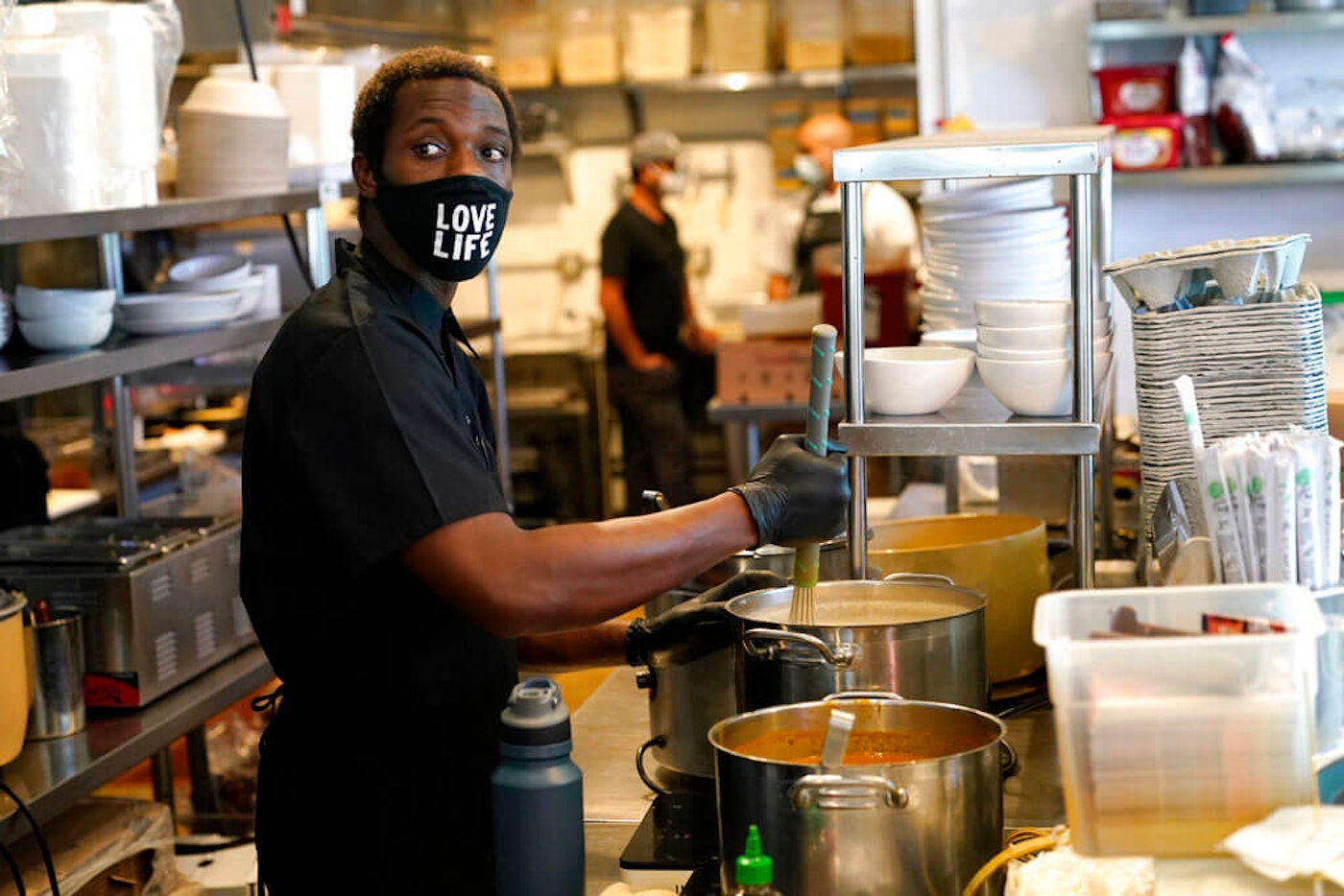 An Orlando trial lawyer said he would sue if Brandes’ bill advances because it targets some of Florida’s most vulnerable populations. In this file photo, Kinoy Miller prepares food at the Love Life Cafe in Miami. Florida-Minimun-Wage