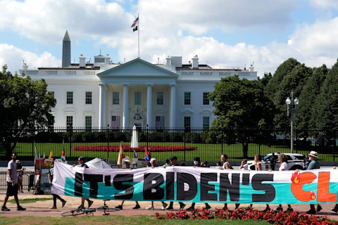 Climate activists rally in front of the White House at Lafayette Square to demand that President Joe Biden declare a climate emergency and move the country rapidly away from fossil fuels, July 4, 2023, in Washington. After being thwarted by Congress, Biden will use his executive authority to create a New Deal-style American Climate Corps that will serve as a major green jobs training program. (AP Photo/Yuri Gripas, File)