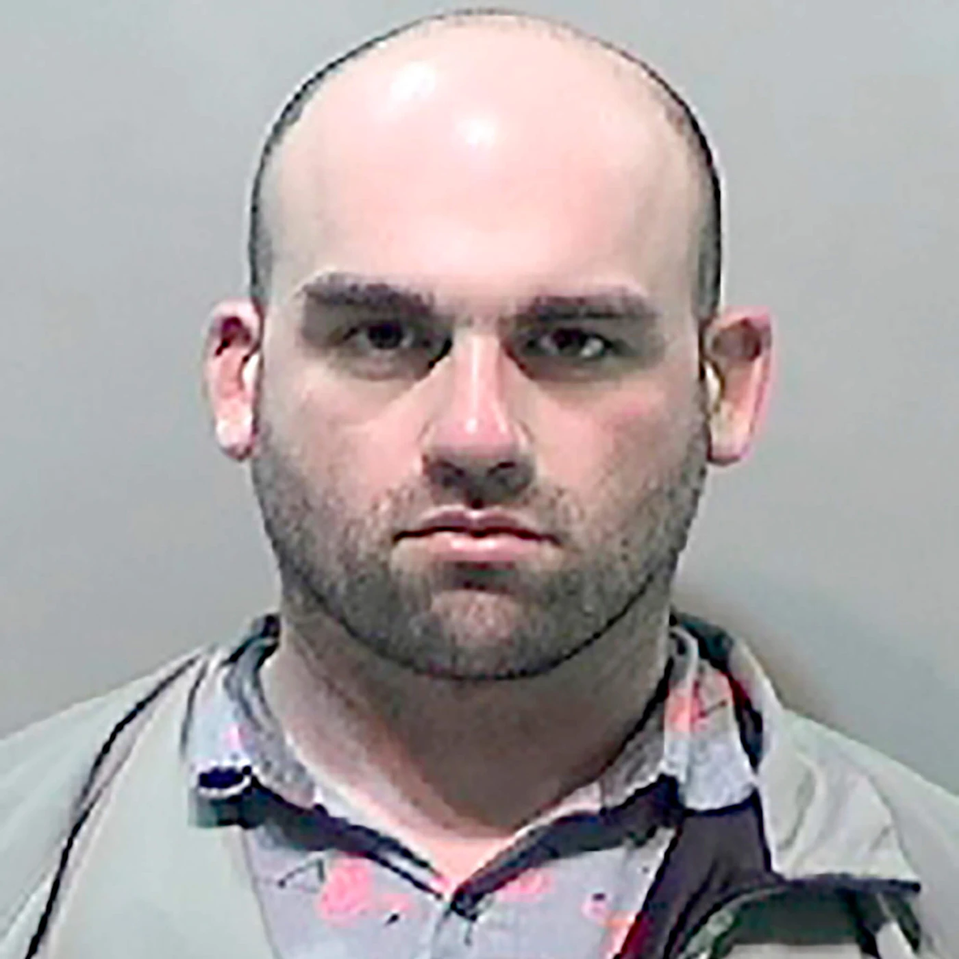 This undated booking photo provided by the Detroit Police Public Safety Office shows Robert Tesh, 32, who has been charged with terrorism for making credible death threats against Michigan Gov. Gretchen Whitmer and Attorney General Dana Nessel. Wayne County prosecutor Kym Worthy said Friday, May 15, 2020, that Tesh made the threats via social media to an acquaintance on April 14.  (Detroit Police Public Safety Office via AP)