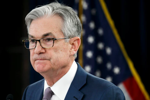 In this Tuesday, March 3, 2020 file photo, Federal Reserve Chair Jerome Powell pauses during a news conference to discuss an announcement from the Federal Open Market Committee, in Washington. Federal Reserve Chair Jerome Powell expressed optimism Sunday, May 17, 2020 that the U.S. economy can begin to recover from a devastating recession in the second half of the year, assuming the coronavirus doesn't erupt in a second wave. But he suggested that a full recovery won't likely be possible before the arrival of a vaccine.. (AP Photo/Jacquelyn Martin, File)