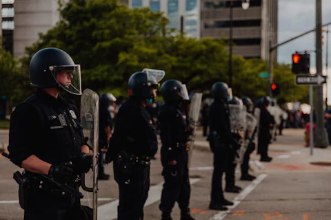 Police in riot gear dispatched to de-escalate a protest in Detroit. (Photo by Franz Knight)