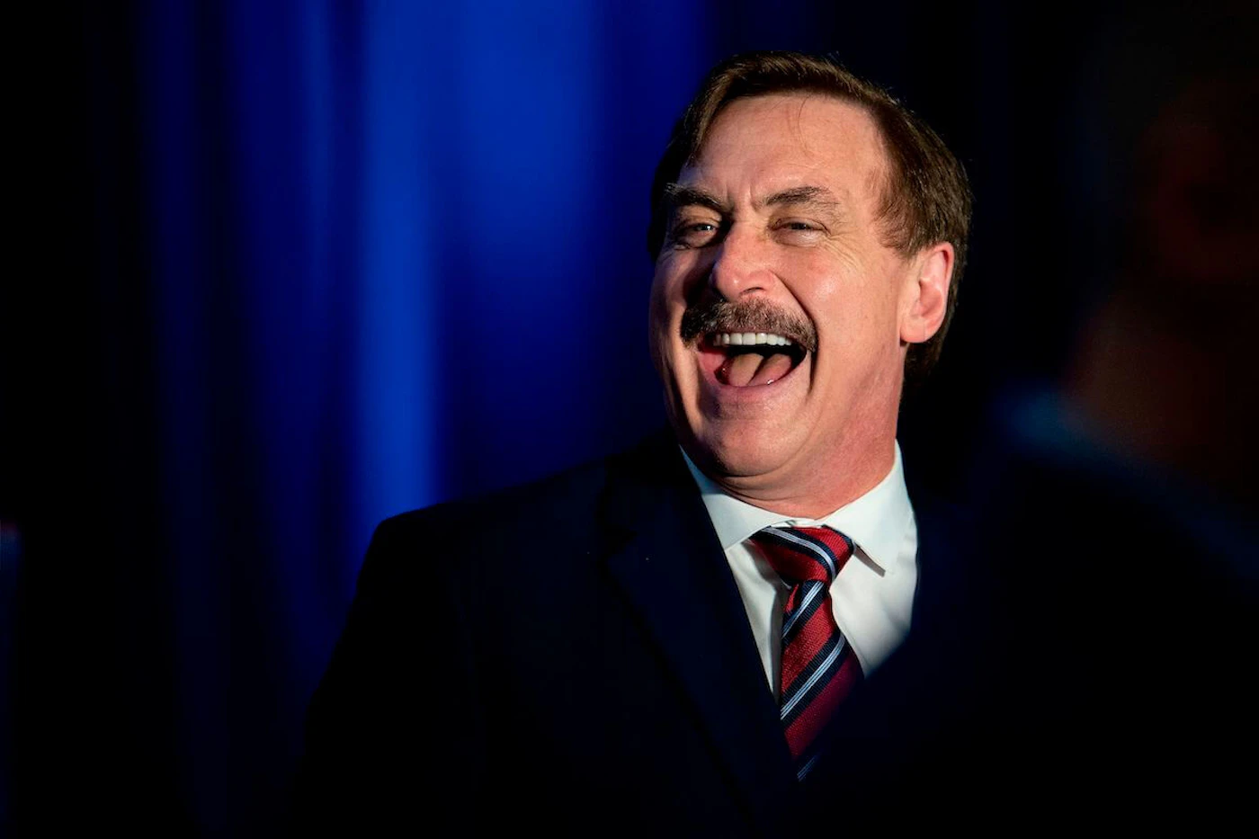 My Pillow CEO Michael Lindell laughs during a "Keep Iowa Great" press conference in Des Moines, IA, on February 3, 2020. (Photo by JIM WATSON/AFP via Getty Images)