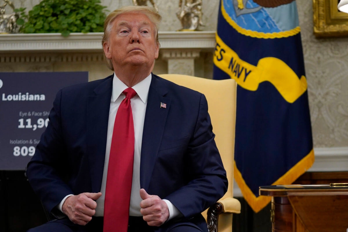 President Donald Trump attends a meeting about the coronavirus with Louisiana Gov. John Bel Edwards in the Oval Office of the White House April 29 in Washington. (AP Photo/Evan Vucci)