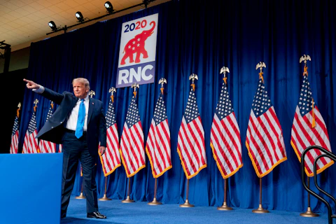 President Donald Trump stands on stage during the first day of the 2020 Republican National Convention in Charlotte, N.C., Monday, Aug. 24, 2020.